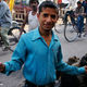 After agreeing to take his picture, Nagand, an unemployed young man in Allahabad, opened his arms in an expansive pose.